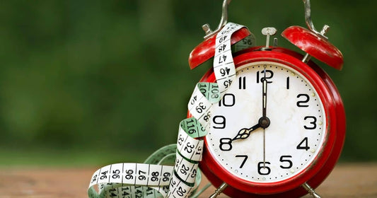 Clock and tape measure to signify how fast is a healthy weight loss